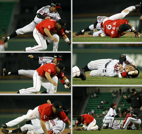 13일 오후 서울 잠실야구장에서 열린 프로야구 LG와 SK의 경기에서 6회말 무사상황 안타를 친 LG 정성훈이 1루에서 SK 정경배와 충돌한 뒤 두 선수 모두 괴로워하고 있다. 