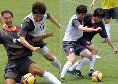 14일 경기도 파주NFC에서 열린 국가대표축구팀 훈련에서 박지성과 신영록-박주영이 패스훈련을 하며 몸싸움을 벌이고 있다. 